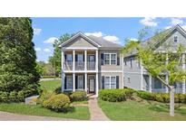 Charming two-story home with a welcoming front porch and well-manicured landscaping at 121 Dunleith Sw Pkwy, Marietta, GA 30008