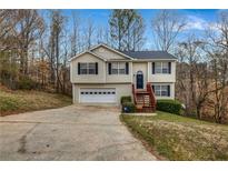 Charming split-level home with a well-maintained front yard and attached garage at 510 Ashland Manor Dr, Lawrenceville, GA 30045