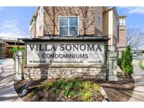 Villa Sonoma Condominiums sign with beautiful landscaping and a stone facade at 10 Perimeter Summit Ne Blvd # 2110, Brookhaven, GA 30319