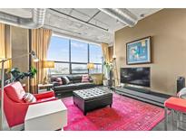 Bright living room with large windows, modern furniture, and stylish decor elements at 115 W Peachtree Nw Pl # 304, Atlanta, GA 30313