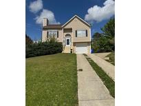 Charming two-story home featuring a well-manicured lawn and a classic suburban aesthetic at 4423 Roche St, Atlanta, GA 30349
