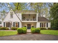 Charming two-story home featuring a balcony, manicured landscaping, and a welcoming entrance at 78 Beverly Ne Rd, Atlanta, GA 30309