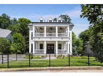 Stunning two-story home with a double-decker front porch, perfect for enjoying the outdoors at 542 Orme Ne Cir, Atlanta, GA 30306