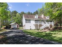 Charming home with attached garage, outbuilding, and well-manicured lawn at 4960 Old Yorkville Rd, Dallas, GA 30157