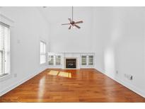 Bright living room with hardwood floors, fireplace, built-in cabinets, and soaring ceilings at 2116 Gorman Se Grv, Atlanta, GA 30316