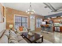 Inviting living room features exposed brick, an open layout, and industrial chic elements at 791 Wylie Se St # 1111, Atlanta, GA 30316