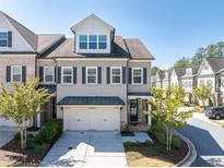 Charming two-story townhouse with a two-car garage and well-manicured landscaping in a desirable neighborhood at 4356 Jenkins Ne Dr, Roswell, GA 30075