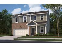 Charming two-story home features a brick and vinyl facade, attached garage, and well-maintained lawn at 7744 Sudbury Cir, Covington, GA 30014