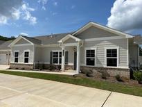 Beautiful single-story home with neutral siding, brick accents, and well-manicured lawn at 3908 Shelleydale Dr, Powder Springs, GA 30127