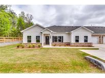 Charming single-story home with a well-manicured lawn and inviting exterior at 3871 Shelleydale Dr, Powder Springs, GA 30127