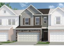 Charming townhome featuring a two-car garage with stone accents and a mix of gray and brown siding at 147 Ravencliff Dr # 147, Austell, GA 30168