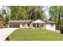 Charming renovated ranch home with a freshly painted exterior and manicured lawn at 4506 Dorset Dr, Decatur, GA 30035
