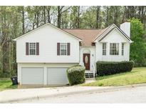 Charming two-story home with a two-car garage and well-maintained landscaping at 169 Concorde Dr, Villa Rica, GA 30180