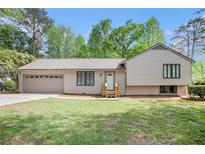 Charming single-Gathering home with a two-car garage and a well-manicured lawn at 5286 Westhill Dr, Norcross, GA 30071