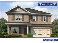 Charming two-story brick home with gray shutters, a covered porch, and a two-car garage at 5011 Fairview Cir, Villa Rica, GA 30180