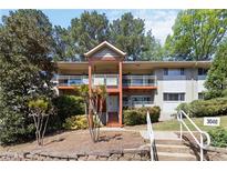 Apartment building featuring multiple levels and private balconies in a wooded, landscaped setting at 3046 Briarcliff Ne Rd # 7, Atlanta, GA 30329