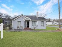 Charming single-story home featuring a well-maintained lawn and a classic architectural design at 1683 Candler Rd, Decatur, GA 30032