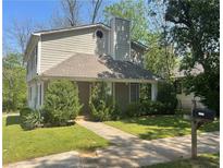 Charming two-story home with a covered front porch and well-maintained landscaping at 1326 Mcpherson Ave., Atlanta, GA 30316