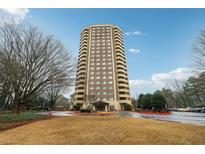 Beautiful building with a circle drive and covered entry with mature trees at 1501 Clairmont Rd # 1624, Decatur, GA 30033