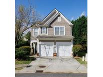 Charming two-story home featuring a two-car garage and landscaped front yard at 2692 Briaroak Dr, Duluth, GA 30096