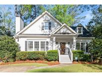 Charming home featuring a manicured lawn, welcoming entryway, and classic architectural details at 2930 Ringle Rd, Brookhaven, GA 30341