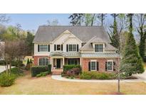Charming two-story home featuring manicured landscaping and a welcoming front porch at 510 Towneside Ln, Marietta, GA 30064