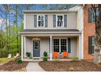 Charming two-story townhome with a covered front porch and inviting curb appeal at 10900 Wittenridge Dr # C1, Alpharetta, GA 30022