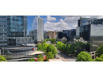 Stunning city view featuring modern buildings, lush trees, and clear blue skies at 3324 Peachtree Ne Rd # 905, Atlanta, GA 30326
