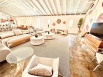 Spacious living room with modern decor, comfortable seating, and bright, natural light at 380 Amal Sw Dr, Atlanta, GA 30315