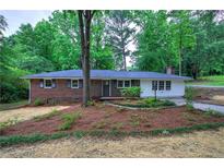 Charming brick home with a landscaped front yard and inviting curb appeal at 3647 Miller St, Lithia Springs, GA 30122