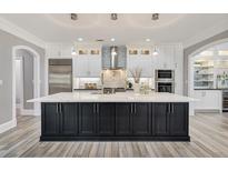 Spacious kitchen with a large island, stainless steel appliances, and lots of cabinet space at 2444 Ballantrae Cir, Cumming, GA 30041