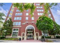 Attractive brick building featuring manicured landscaping and a covered entrance with building address at 3820 Roswell Ne Rd # 211, Atlanta, GA 30342