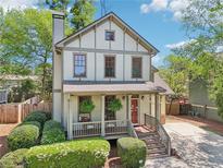 Charming two-story home with a landscaped yard, covered porch, and inviting curb appeal at 2124 Marshalls Se Ln, Atlanta, GA 30316