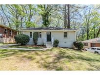 Charming one-story home with well-maintained lawn, landscaping, and a brick accent wall in a quiet neighborhood at 2240 Polar Rock Sw Ave, Atlanta, GA 30315