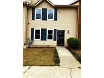 Inviting two-story home with blue shutters and a well-maintained lawn at 912 Holden Ln, Atlanta, GA 30349