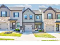 Charming townhomes featuring craftsman-style architecture and well-maintained landscaping at 7154 Sw Chara Sw Ln, Atlanta, GA 30331