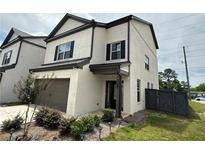 Two-story painted brick home with a single-car garage, black shutters, and a landscaped front yard at 4215 Almanor Cir, Norcross, GA 30071