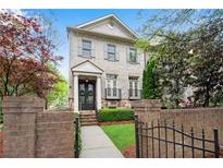 Elegant brick townhome with landscaped front yard and gated entry at 3663 Brookhaven Manor Ne Xing, Atlanta, GA 30319