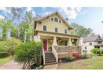 Charming two-story home with a inviting front porch and landscaped front yard at 1745 Mary Lou Ln, Atlanta, GA 30316