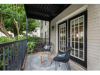 Cozy covered patio featuring stylish wicker furniture and peaceful outdoor views at 3701 Essex Ave # 2, Atlanta, GA 30339