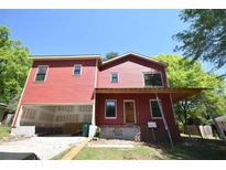 This new construction features a 2-story house with a covered porch and an attached unfinished garage at 3689 Ashwood Se Dr, Smyrna, GA 30080