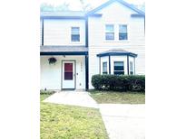 Charming home featuring clean white siding, black trim, and well-kept front yard at 2896 Lakemont Sw Dr, Marietta, GA 30060