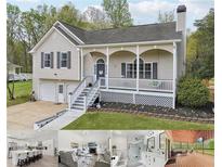 Charming home featuring a welcoming front porch and well-maintained landscaping at 106 Thornwood Dr, Woodstock, GA 30188