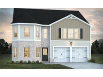 Charming two-story home featuring a brick facade, attached two-car garage and classic architectural design at 319 Overlook Rd, Covington, GA 30014