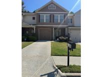 Charming two-story home with a well-maintained front yard, garage, and mailbox with visible address at 3627 Mcclaren Way, Lawrenceville, GA 30044