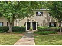 Charming two-story townhome with lush landscaping, brick facade and inviting walkway at 3665 Essex Ave # 28, Atlanta, GA 30339
