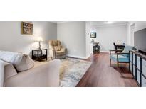 Inviting living room with neutral tones, plush seating, and an open floor plan to the dining area at 3085 Colonial Way # L, Atlanta, GA 30341