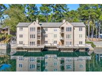 Beautiful waterfront property with scenic views reflected in calm waters at 610 Mill Pond Se Dr, Smyrna, GA 30082