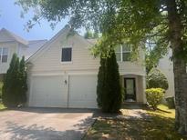 Charming two-story home featuring an attached two-car garage and well-maintained landscaping at 3226 Saville Sw St, Atlanta, GA 30331