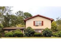 Two-story home with manicured lawn and garden at 3670 Whirlaway Dr, Decatur, GA 30034